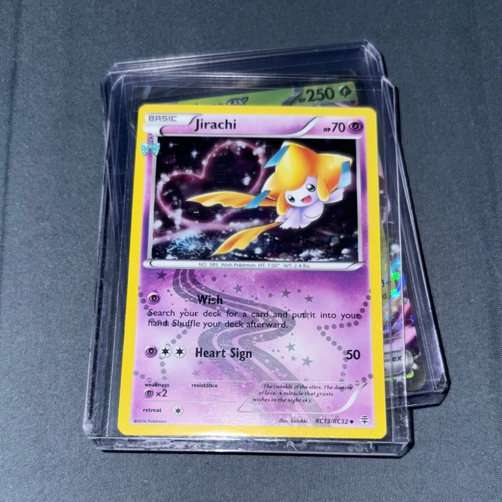Pokemon Jirachi Card - Purple and Yellow